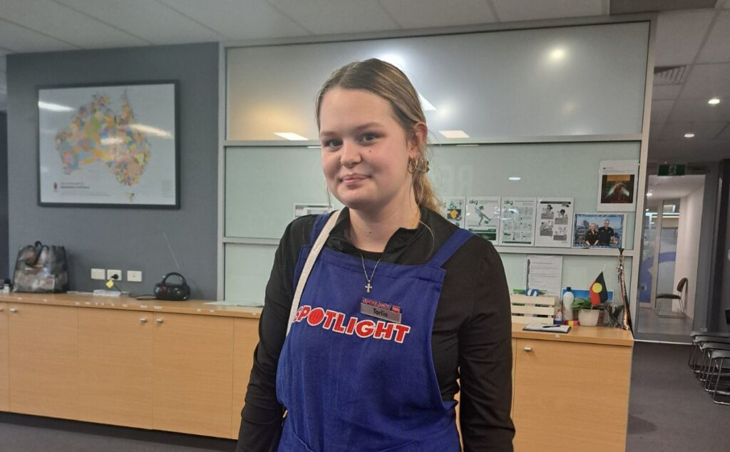 Tarlia working in spotlight store